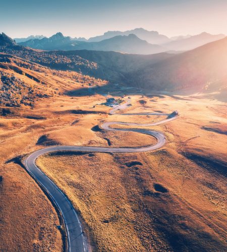 Winding,Road,In,Mountain,Valley,At,Sunset,In,Autumn.,Aerial